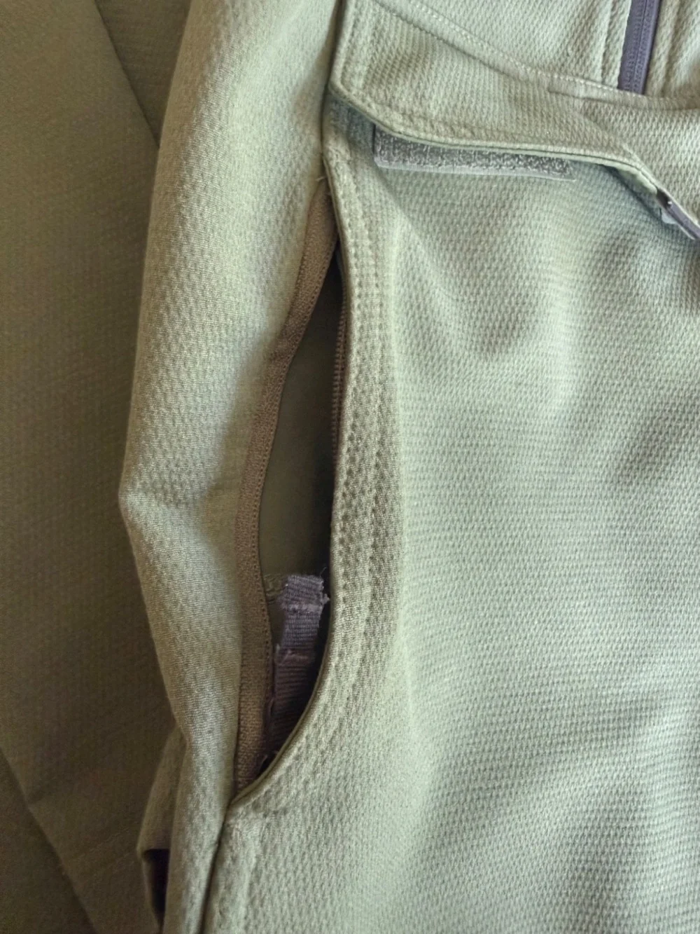 olive green The North Face Tekno Ridge Hoodie features a kangaroo pocket